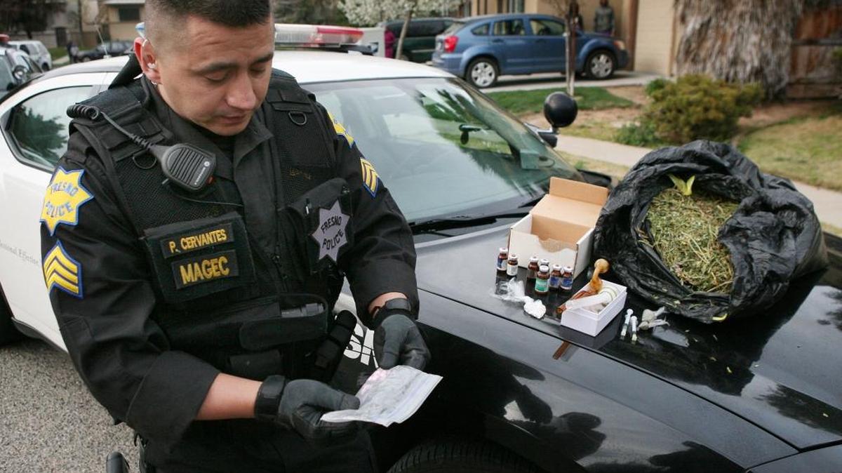 Fresno police Sgt. Paul Cervantes displays drugs and paraphernalia seized in a warrant search on a home in north Fresno in 2013. In a lawsuit filed Monday, March 21, 2016, Cervantes is suing the Fresno Police Department and three detectives, accusing them of subjecting him to workplace harassment and discrimination due to his Hispanic ethnicity.