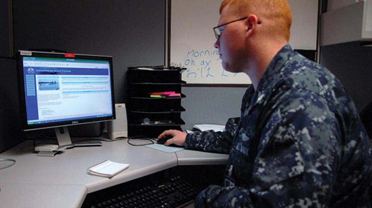 A Navy sailor logs on to the Naval Education and Training Command website.