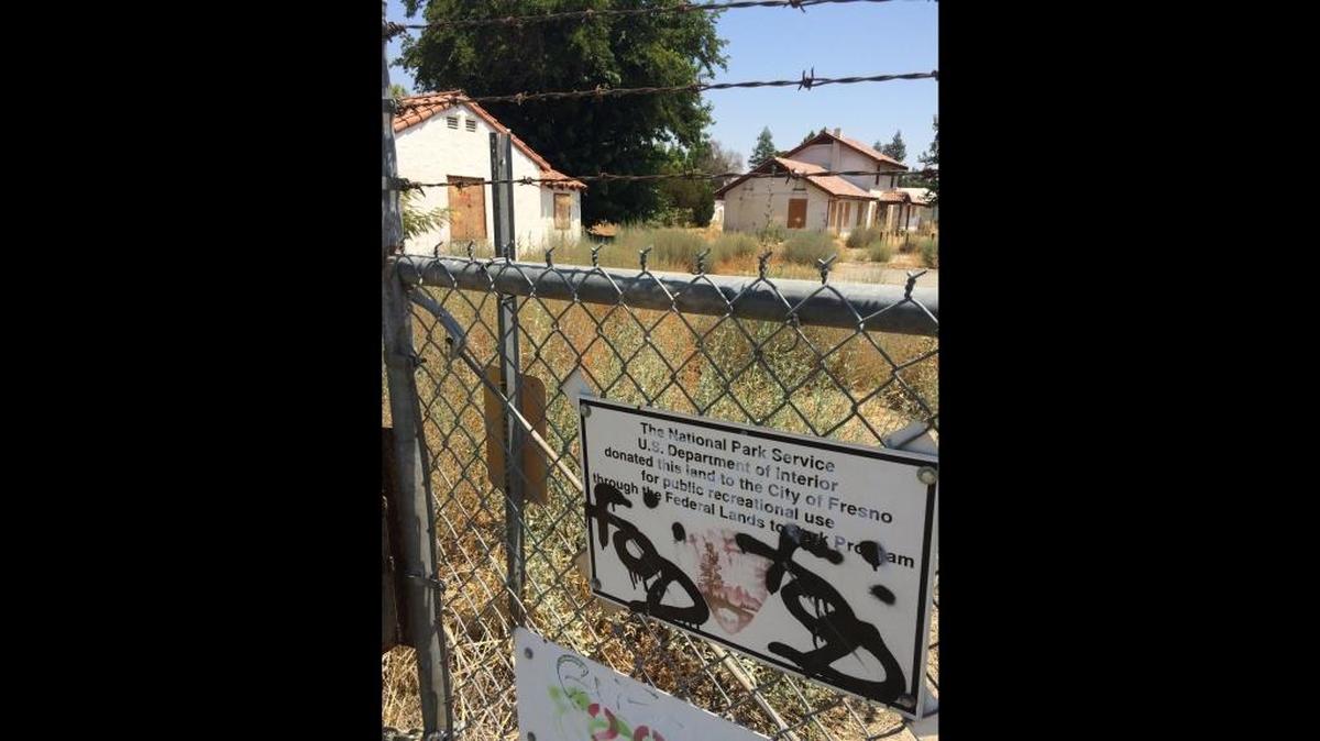 Abandoned buildings and weeds mark a former U.S. Department of Agriculture research site on Peach Avenue in southeast Fresno in this 2016 file photo. The 49-acre site was deeded to the city by the National Park Service in 2006 with the condition that it be used for park and recreation purposes.