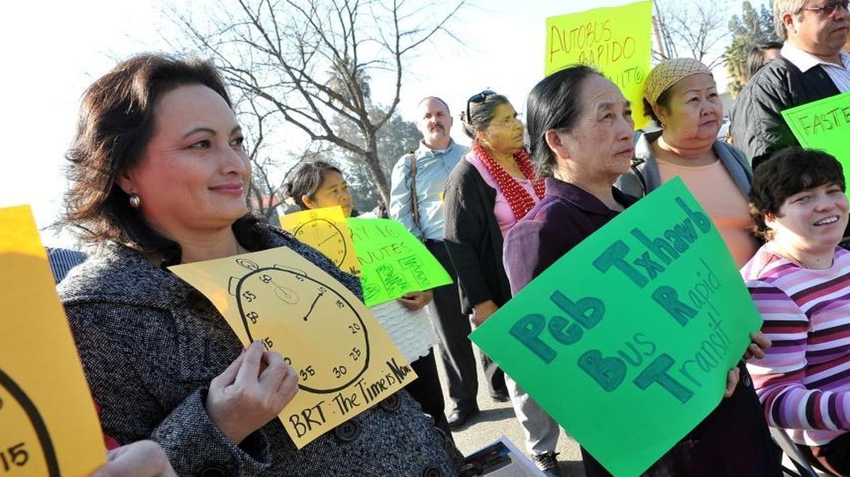 People, including Ger Her, left,rally at Manchester Mall in 2014 in support of the proposed Bus Rapid Transit system .