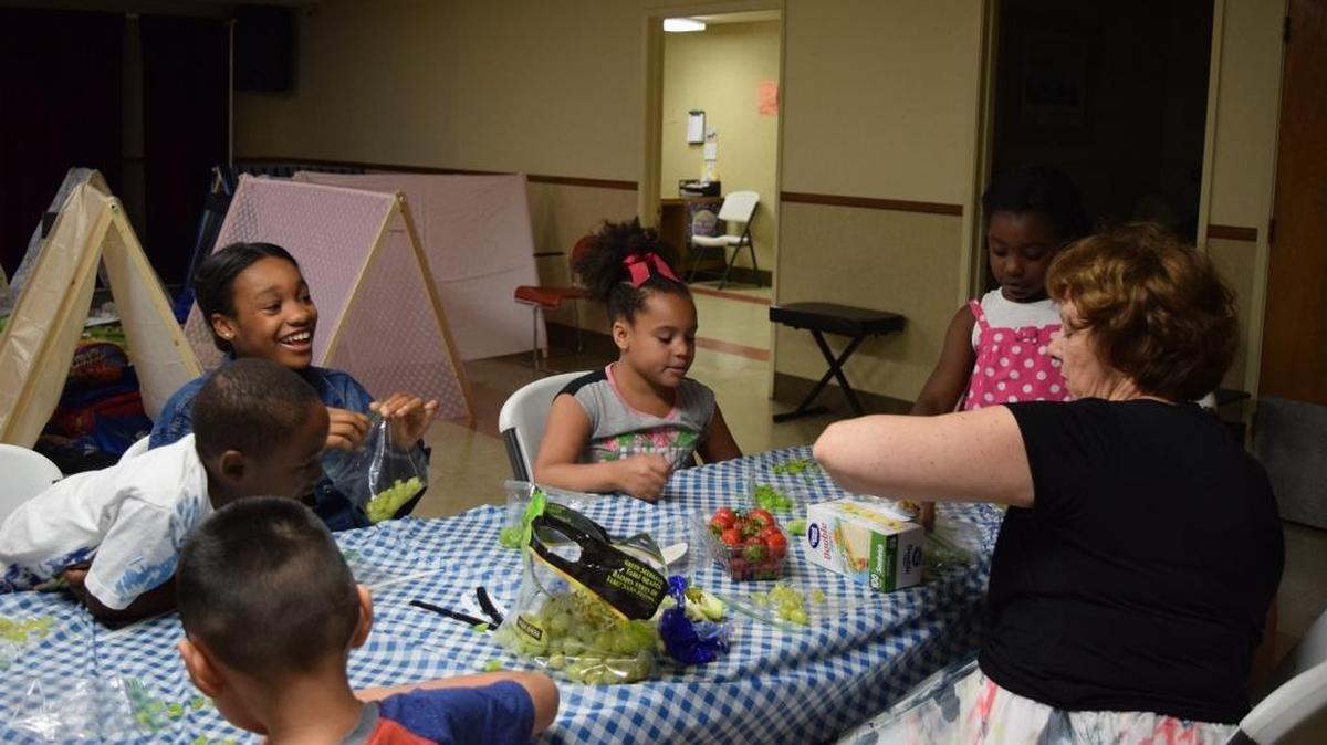 Kids at the Boys 2 Men Girls 2 Women summer camp program learn to cook by helping to prepare their own lunches on July 27, 2017.