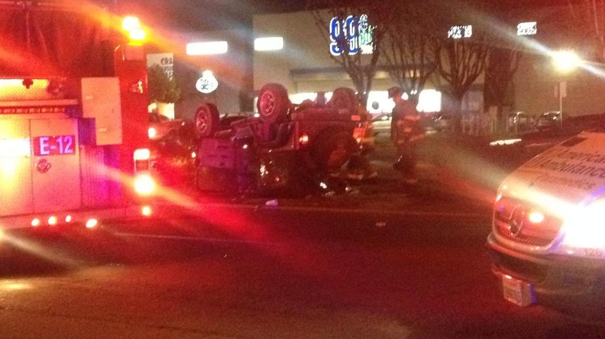 A Jeep sits on its roof on busy Shaw Avenue after an accident Saturday night, Dec. 26, 2015 in northwest Fresno.