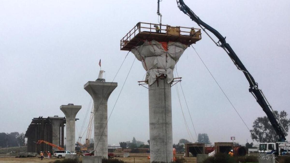 In a December 2016 file photo, a viaduct for elevated tracks of the high-speed project through the central San Joaquin Valley takes shape near Cedar and North avenues and Highway 99.