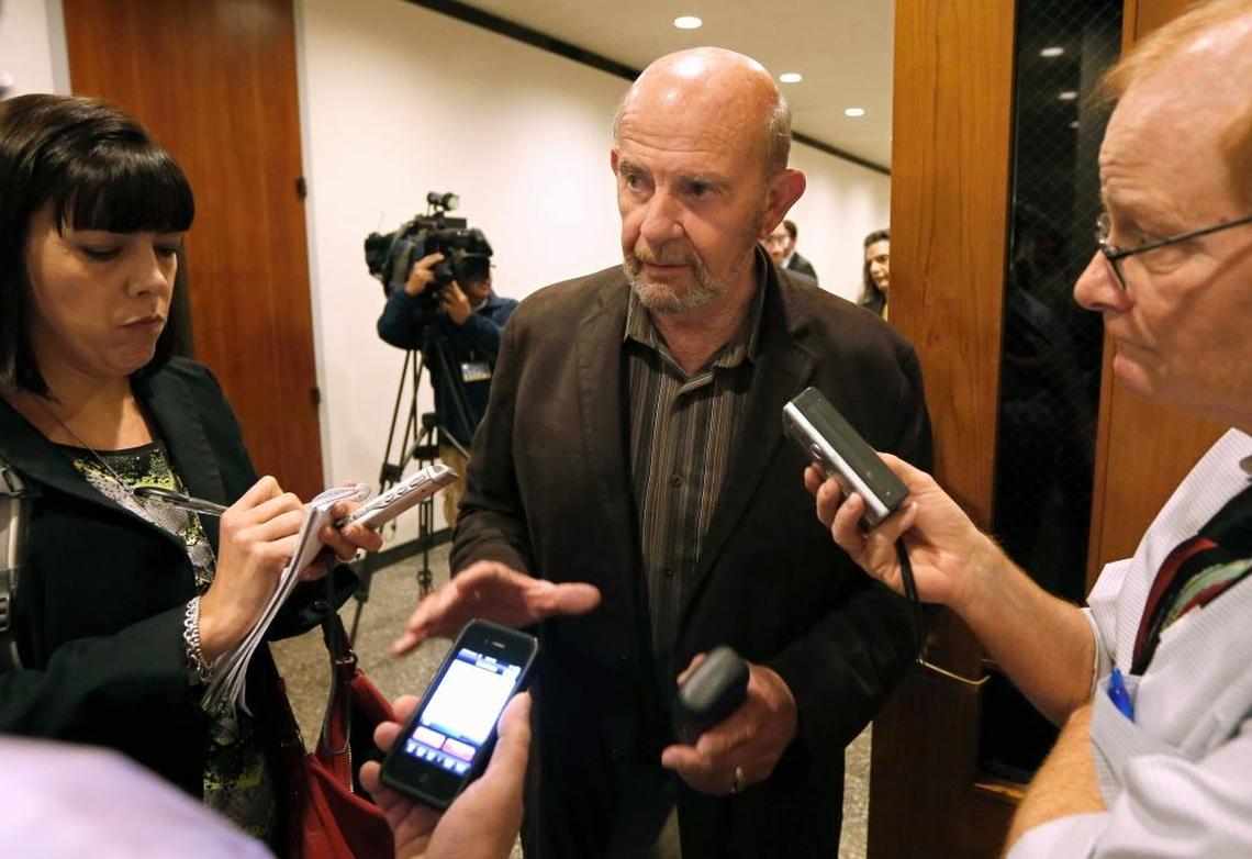 John Tos, center, a Hanford farmer and the lead plaintiff in a lawsuit against the California High-Speed Rail Authority, talks with reporters after a hearing in the case in Sacramento County Superior Court in November 2013. Tos’ lawsuit is separate from another Kings County casef for which a settlement was announced on Thursday, Aug. 15, 2019.
