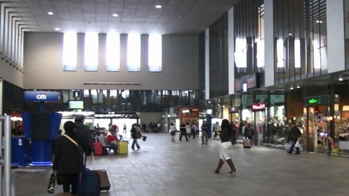Passengers browse retail shops that lease space on the upper level of the Santa Justa high-speed train station in Seville, Spain. Passenger boarding platforms are downstairs. The California High-Speed Rail Authority is seeking consultants to draw up construction plans for a station in Fresno.