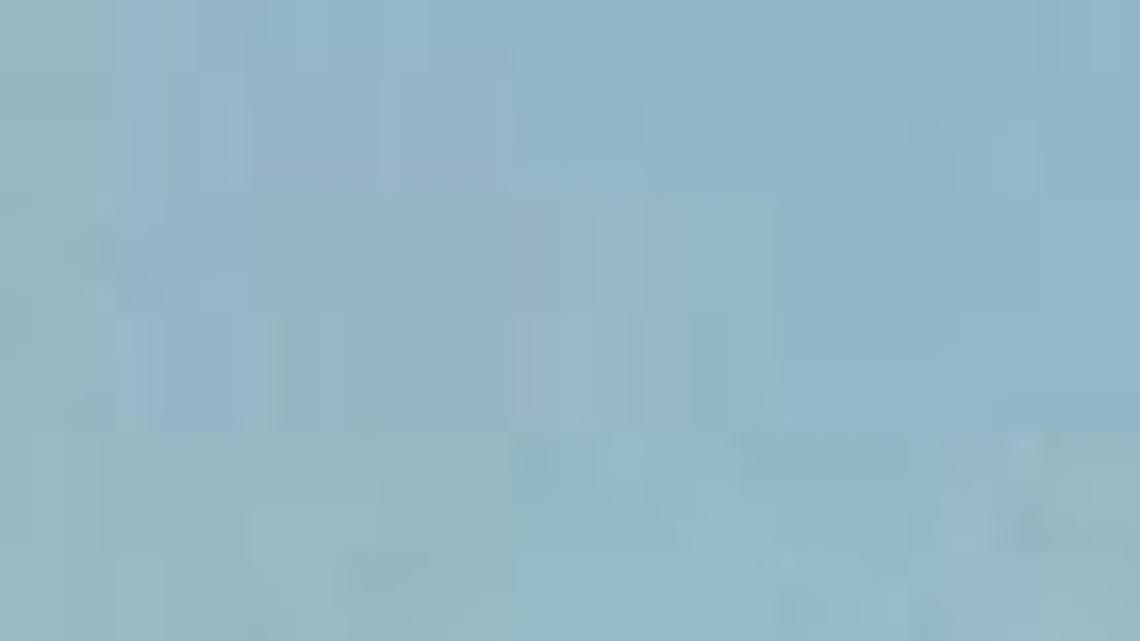 
An artist’s depiction of a high-speed train zooming through downtown Fresno.
