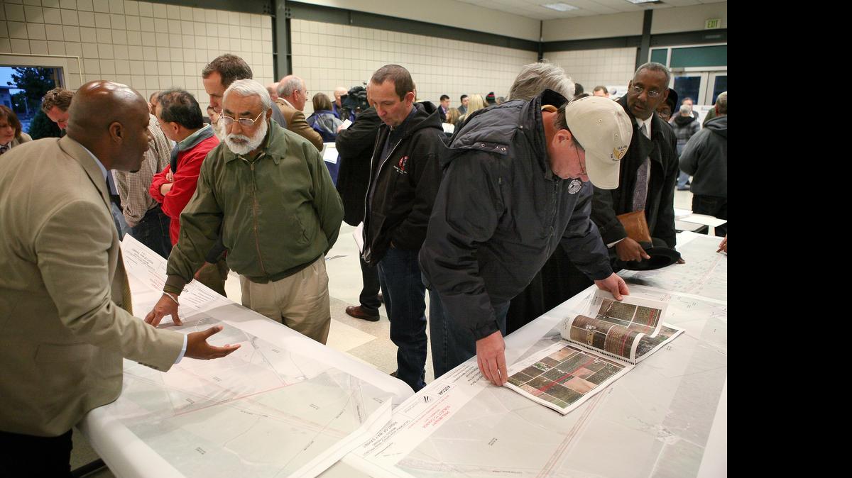 
At a 2012 open house in Madera, California High-Speed Rail Authority planners meet with the public to review the bullet-train route through the region and discuss concerns. The rail agency and its contractor will hold an open house Thursday in Fresno over the route and business opportunities working on the project.
