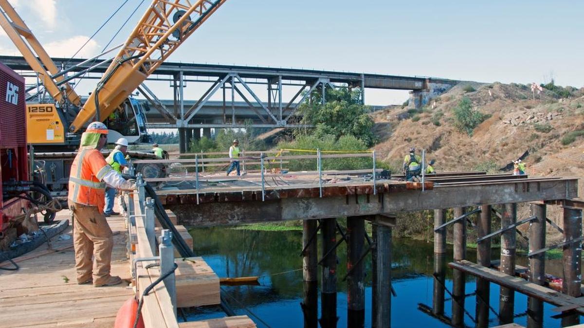 Contractors for the California High-Speed Rail Authority work on building a viaduct that will span the San Joaquin River at the Fresno-Madera county line.