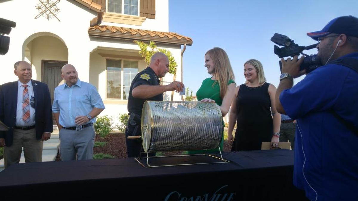 Fresno police Chief Jerry Dyer draws the winner’s name Monday during Granville’s Home of Hope drawing.