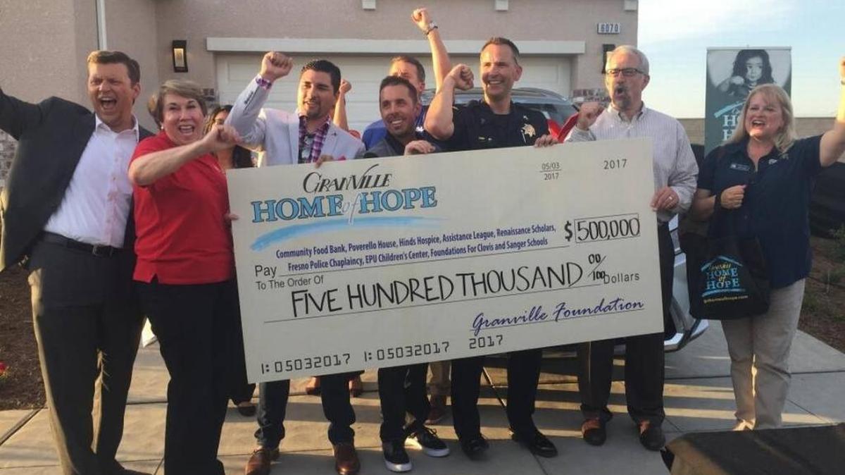 Representatives from local nonprofits celebrate after raising $500,000 through the 2017 Granville Hope of Home raffle.