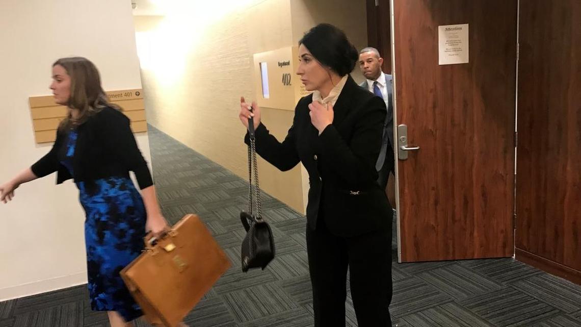 Physician assistant Bella Albakova, right, takes a break during her testimony Wednesday, Jan. 17, 2018, in the medical malpractice civil trial of Fresno heart surgeon Pervaiz Chaudhry. She told a Fresno County Superior Court jury that Chaudhry left the operating room during open-heart surgery, leaving her to close the chest of a patient in April 2012.