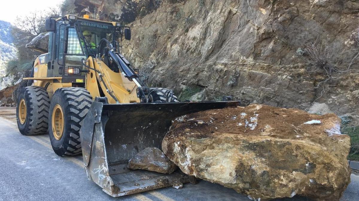 Crews work to clear a rock slide that slowed traffic inside Sequoia National Park on Wednesday.