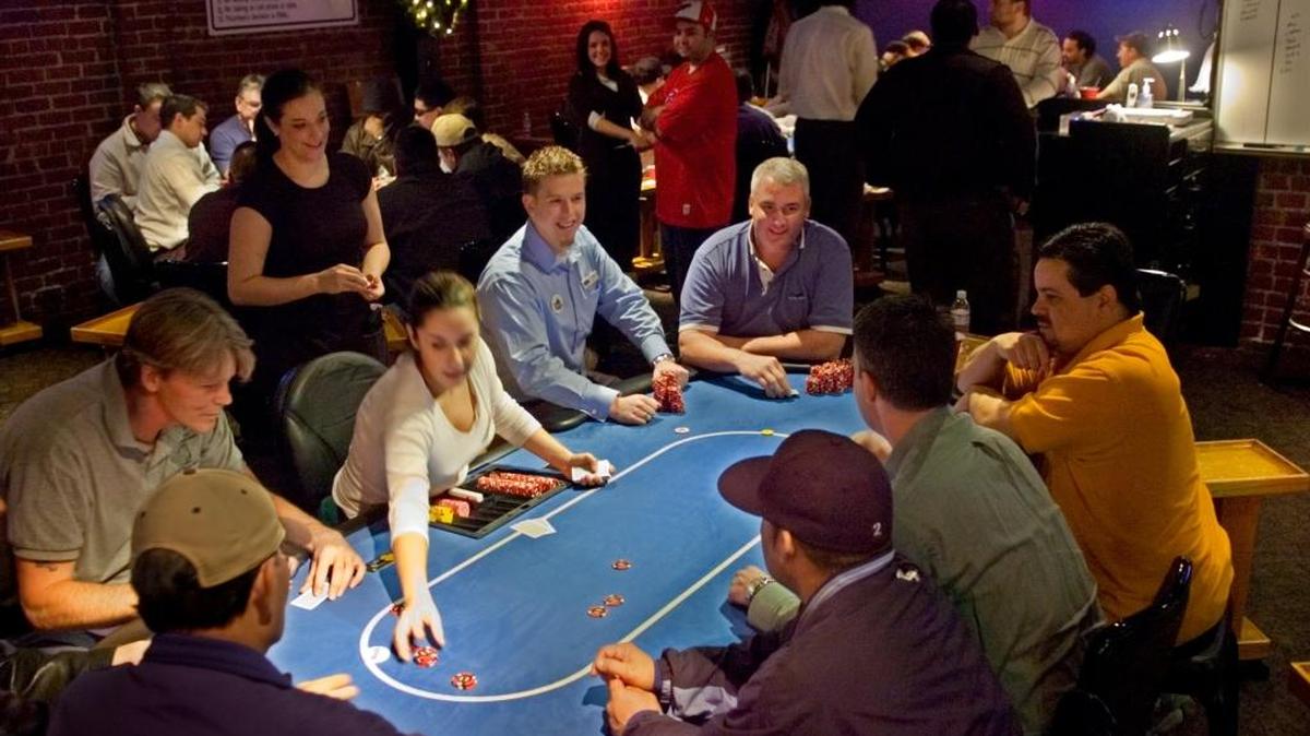 Poker players face off at the Limelight Card Room in Sacramento. It’s one of three card rooms in the city. A company tied to the card room industry is trying to prevent an Indian tribe from opening a casino in Elk Grove.