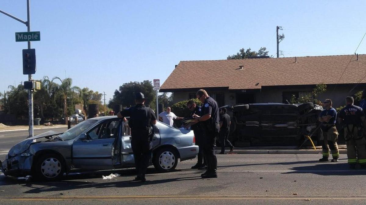 Two vehicles were involved in a crash that caused one to smash into an iron fence on Maple Avenue on Sunday, Oct. 9, 2016.