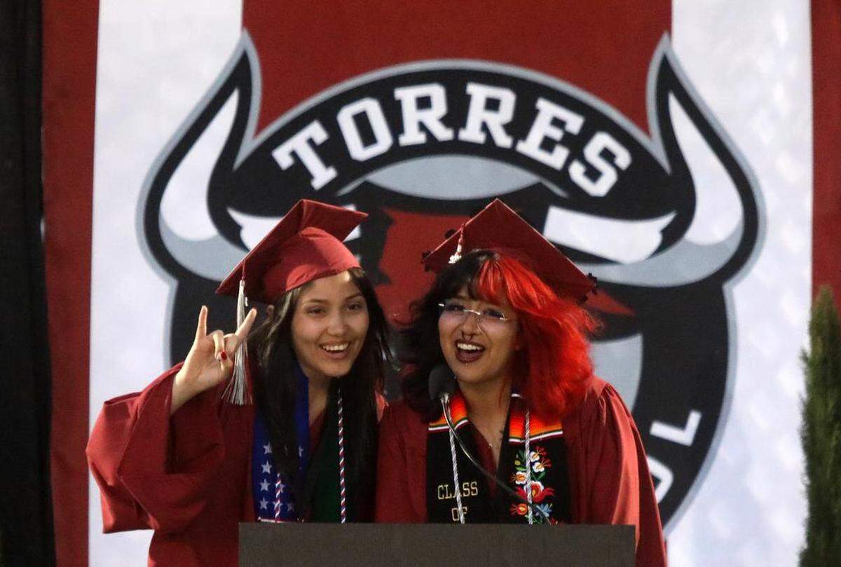 Angela Llamas and Alondra Luna Velásquez delivered a joint speech during the first graduation ceremony for Matilda Torres High School at Madera Memorial Stadium on June 10, 2023.
