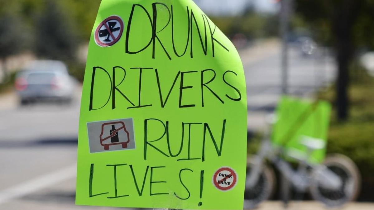

A sign left near the scene of the July 2012 crash that killed 7-year-old Donovan Maldonado. Former Central High School boys basketball coach Loren LeBeau accepted a plea deal in the DUI manslaughter case.
