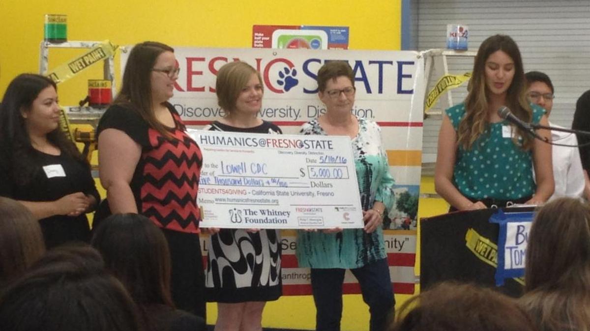 Esther Delahay, executive director of Lowell Community Development Corporation, accepts a $5,000 grant from the Students4Giving Philanthropy Project at Fresno State.
