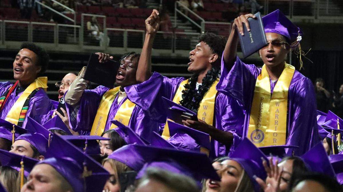 A group of graduates celebrate during the Fresno High graduation ceremony held at the Save Mart Center on June 5, 2023.
