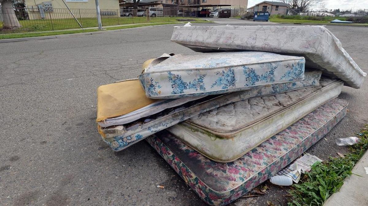 A pile of discarded mattresses lay on the street in the cul-de-sac across from the apartments at 2061 S. Hayston Ave. in southeast Fresno.