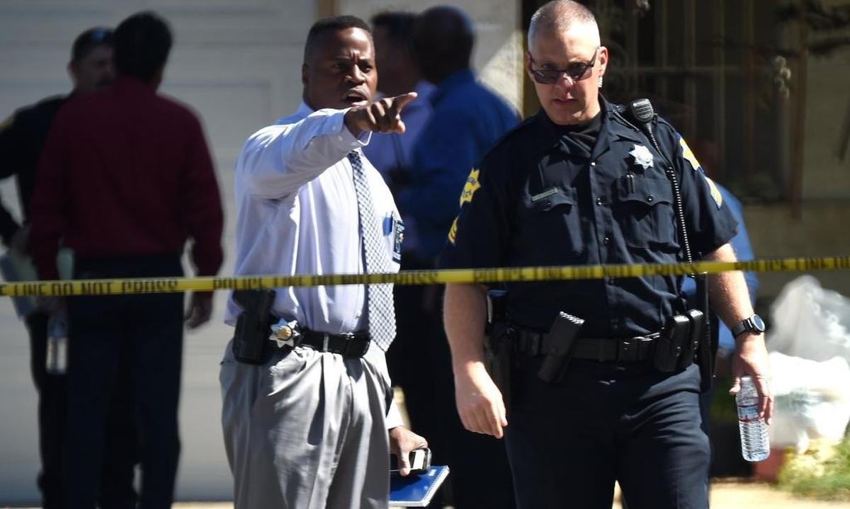 Fresno police investigators work the scene of the shooting at 5267 E. Hammond Ave. in east-central Fresno on Tuesday morning, June 6, 2017. Police said four people were shot; three are dead.