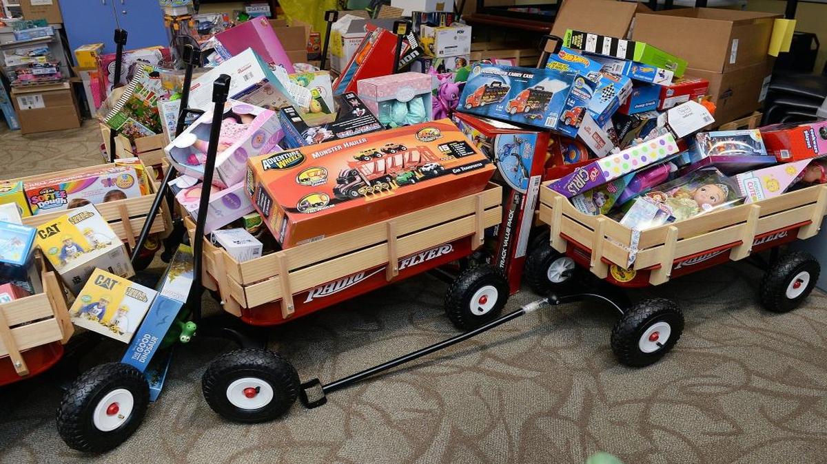 A fleet of new Radio Flyer wagons were filled with toys to be given to patients at Valley Children’s Hospital in Madera. A Fresno group, Boys2MenGirls2Women, has only half the toys it needs to give to children Thursday.