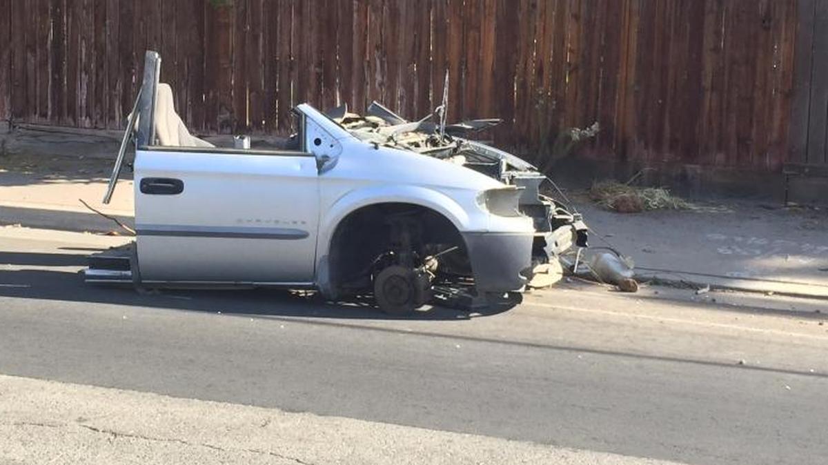 City workers don’t pick up portions of cars, such as this hulk on Palm Avenue between Olive and McKinley avenues, as part of the annual Operation Cleanup in Fresno.