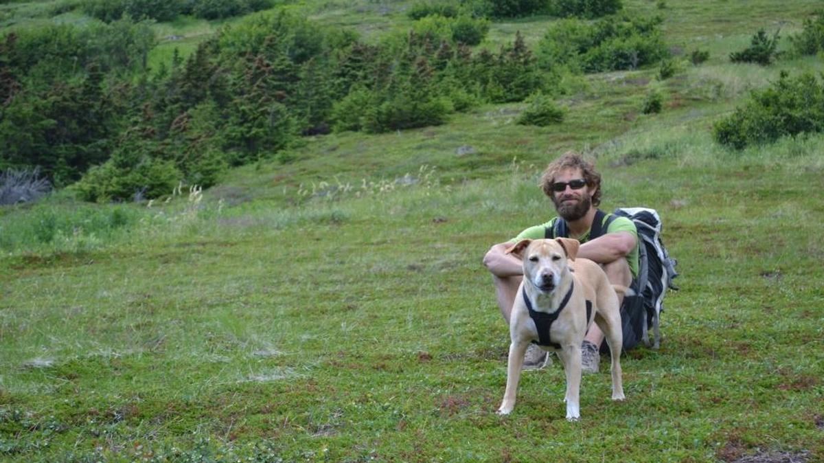 John Barraco and his blonde Labrador, Mr. Chili, during a hiking trip in Alaska.