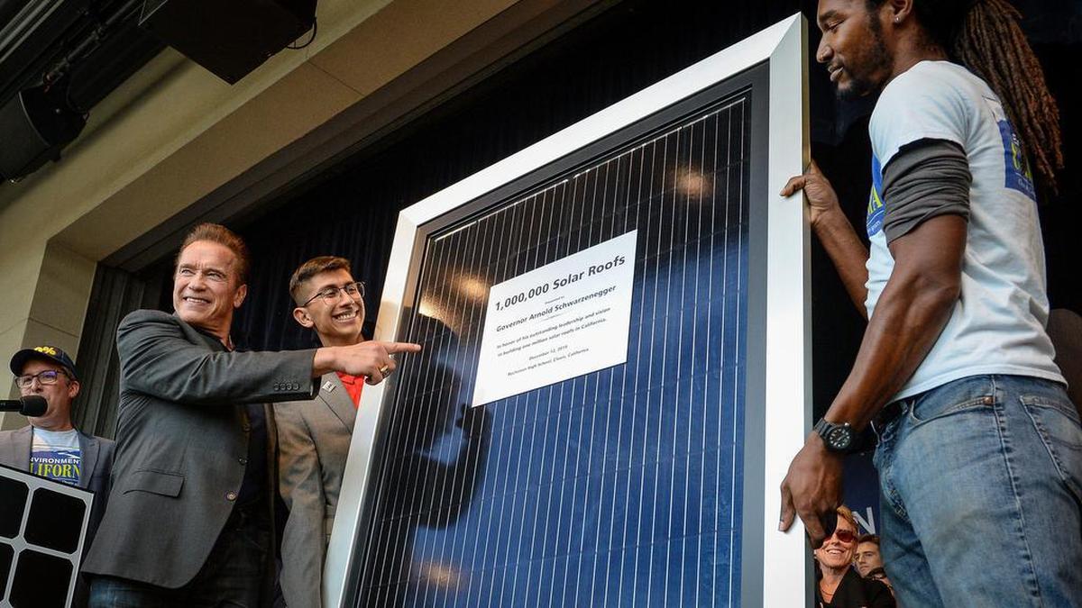 Former California Governor Arnold Schwarzenegger is presented with the 1 millionth solar roof as a gift for his leadership in the accomplishment of 1 million solar roofs across the state of California during a ceremony at Buchanan High School in Clovis on Thursday, Dec. 12, 2019.