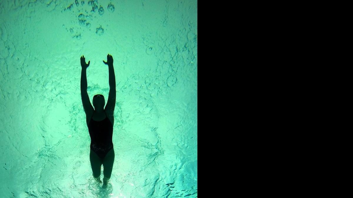 
Breanna Bond swims before practice at Clovis North High School in Clovis, California on May 13, 2015. Bond swims 6 days a week in addition to walking trails, staying active, eating clean and attributes her weight loss to her healthy lifestyle.
