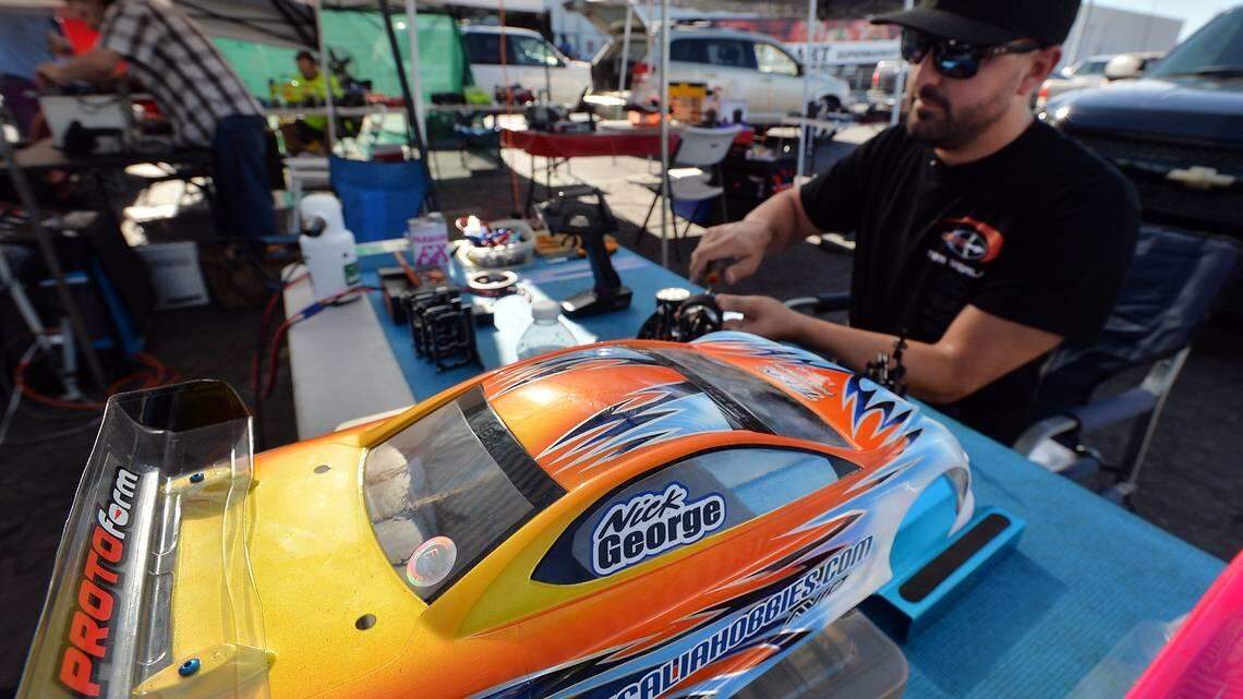 Nick George, of Visalia, works on a electric remote-control race car at HobbyTown USA in Fresno. Although HobbyTown eventually closed, it’s scheduled to reopen in October 2021.