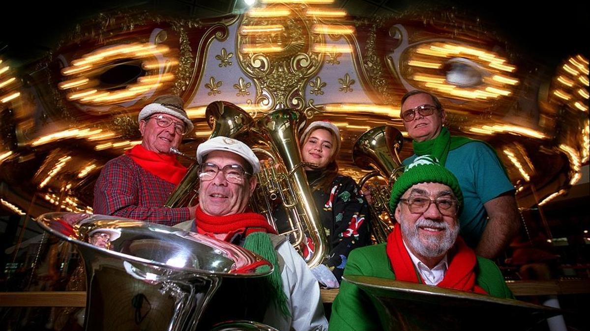 Burl Walter Jr., lower right, and other members of the Tuba Christmas band photographed on Nov. 27, 1998.