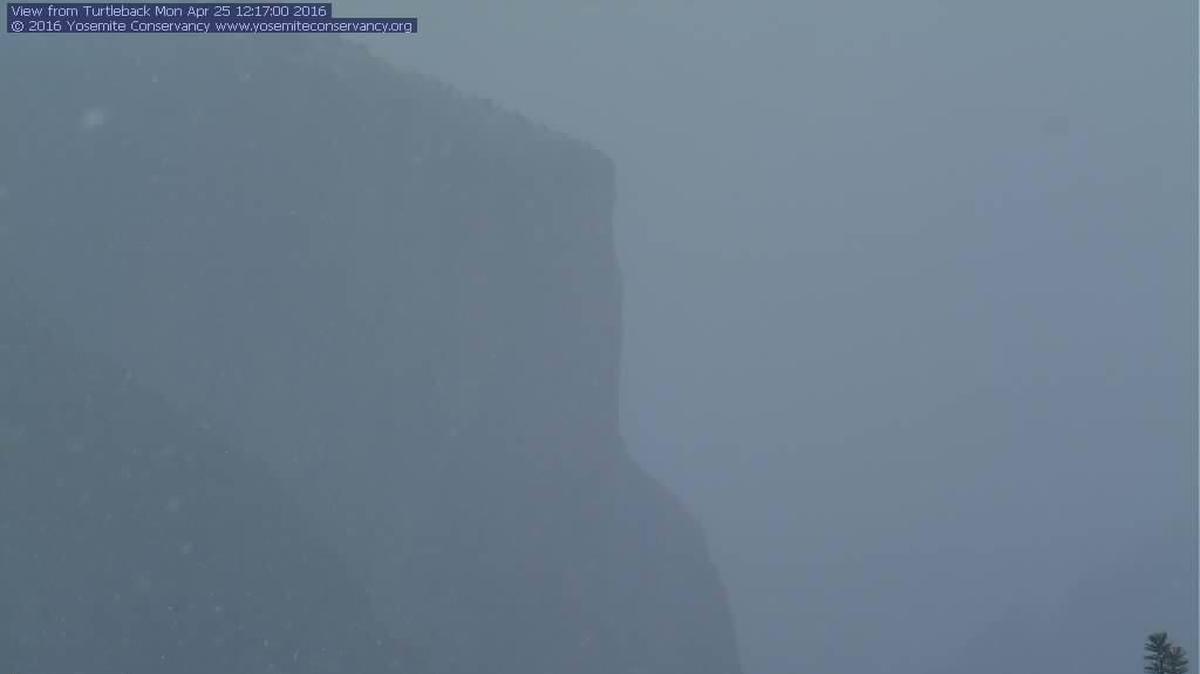 Yosemite National Park’s El Capitan is obscured by storm clouds around 12:15 p.mk. Monday. A spring storm has brought cold temperatures, snow flurries and wind to central California.