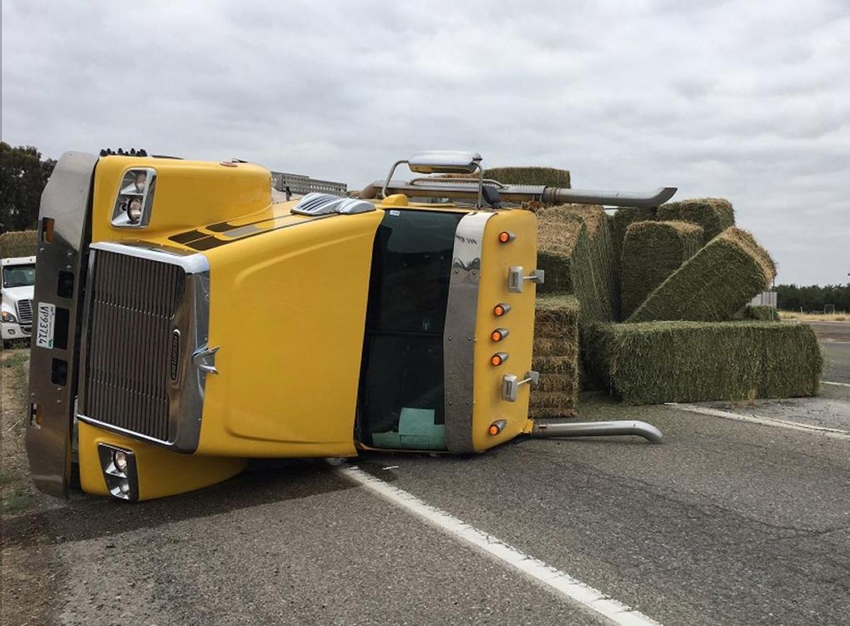 A big rig carrying hay bales overturned Friday morning, forcing a closure from the interchange from southbound Highway 99 to westbound Highway 152, the California Department of Transportation reported. It is the third big rig to overturn on Highway 99 between Merced and Madera this week.
