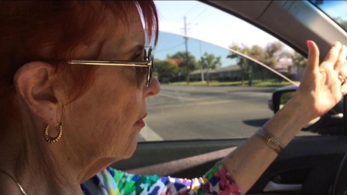 Kelly Chaidez gestures as she talks about road construction while driving in central Fresno.