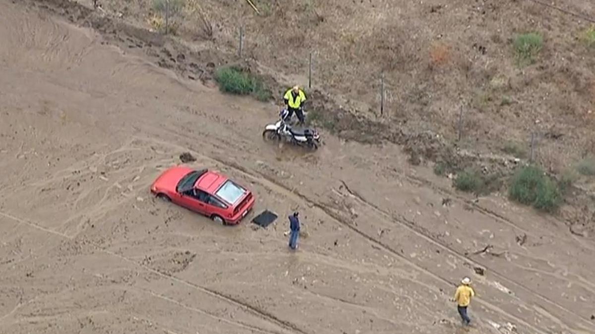 
This still frame from video provided by KABC-TV shows vehicles stuck in a muddy road in the mountainous community of Lake Hughes, about 65 miles north of downtown Los Angeles on Thursday. Flash flooding in northern Los Angeles County has filled several roads with mud, stranding vehicles and blocking traffic on one of the state’s main highways.
