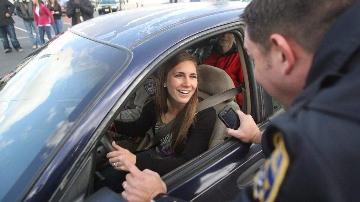 In this file photo, Clovis High School student Megan Buettner, 17, is briefed by CHP officer Matt Radke prior to driving a challenging course in which she will be texting while driving. She and three other students ran through the course in front of a crowd of fellow students during lunchtime to demonstrate the dangers of distracted driving.