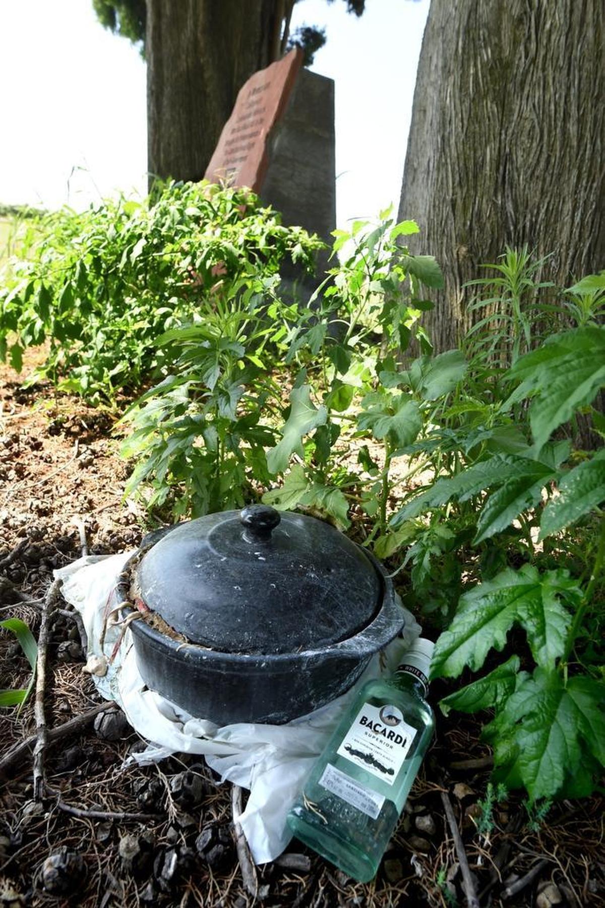 Left a few feet from the memorial to California’s Confederate veterans of the Civil War was a bottle of liquor and a meal of some sort in a pot, at the Bethel Cemetery south of Sanger.