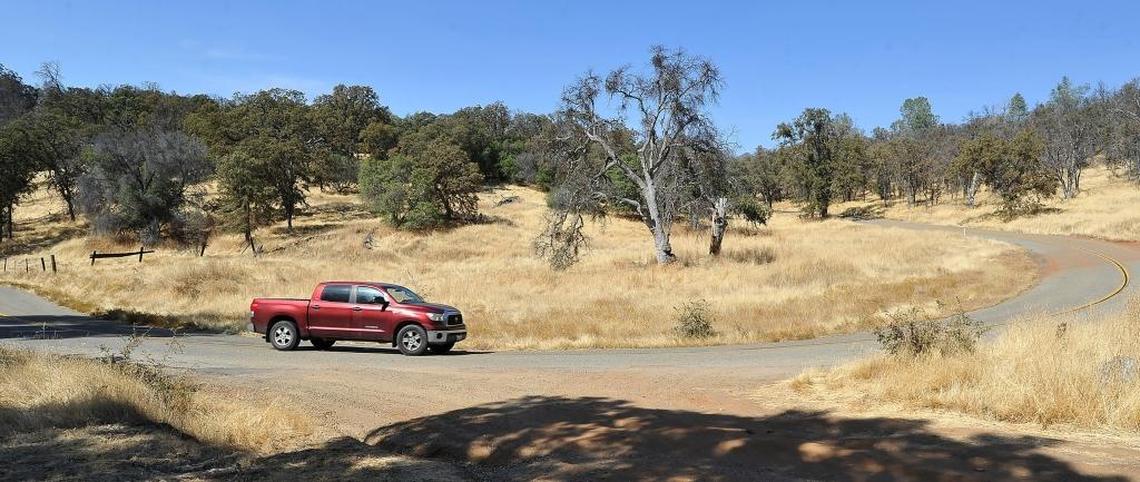 A pickup truck passes the site of the once-booming town of Grub Gulch on Road 600, about five miles south of Ahwahnee.
