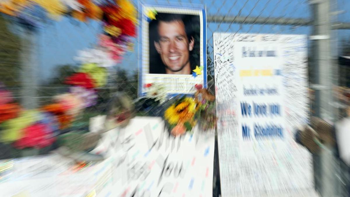 6essages, flowers and running shoes hang on a fence at Fort Washington Elementary School where Gavin Gladding was an administrator. The father of two was killed by a hit-and-run driver on Friant Road on Sept. 16.