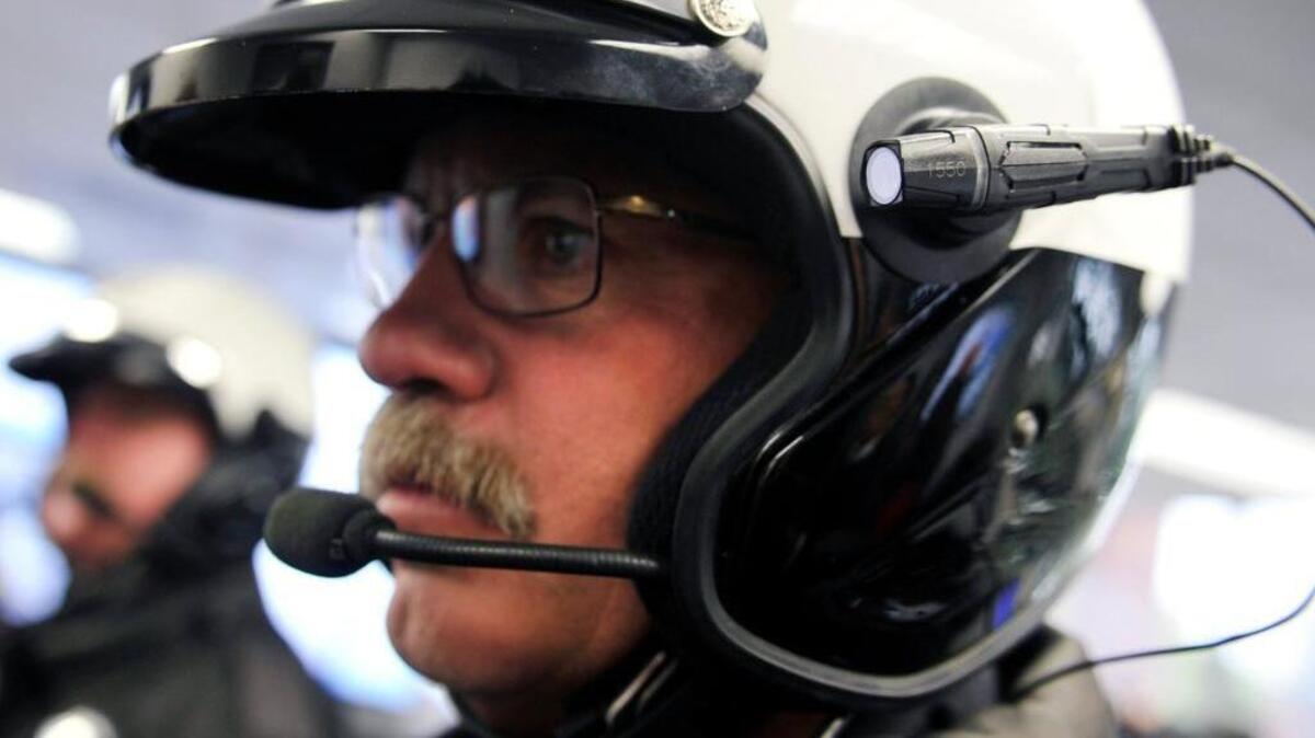 Fresno Police motorcycle traffic officer James Beebe wears an Axon Flex body camera mounted by suction cup to his helmet at a January 2015 news conference where police Chief Jerry Dyer announced the department would begin equipping its officers with body cameras.