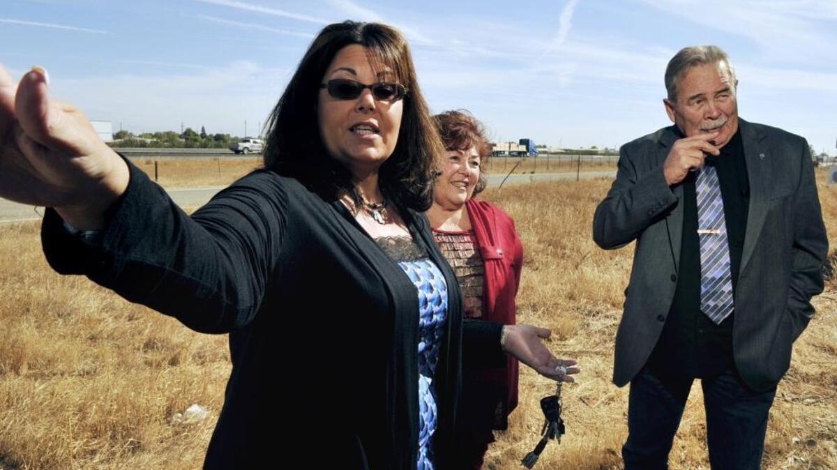 Tribal Chairwoman Maryann McGovran, left, Elaine Bethel-Fink, tribal vice chairperson, center, and former tribal council member Patrick Beihn, right, talk in 2014 about the land that belongs to the North Fork Rancheria of Mono Indians of California west of Highway 99 and north of Avenue 17.
