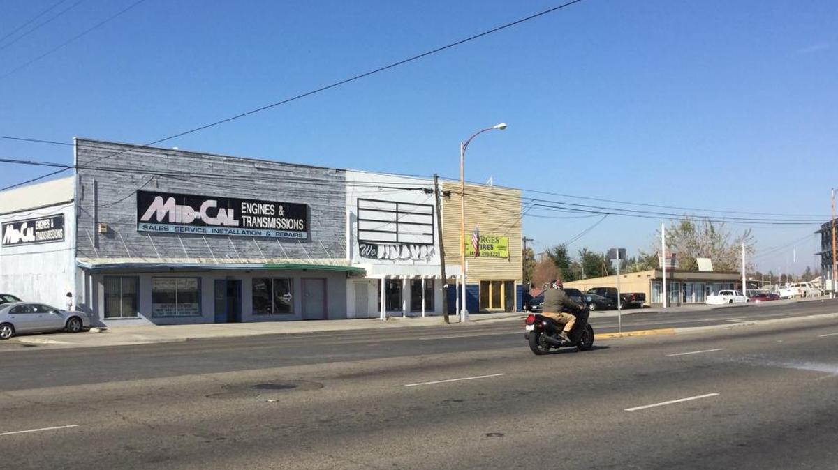 A collection of automotive shops along Blackstone Avenue between Home and McKinley avenues is the proposed site for a mixed-use development of 88 apartments combined with commercial space, possibly a medical clinic.