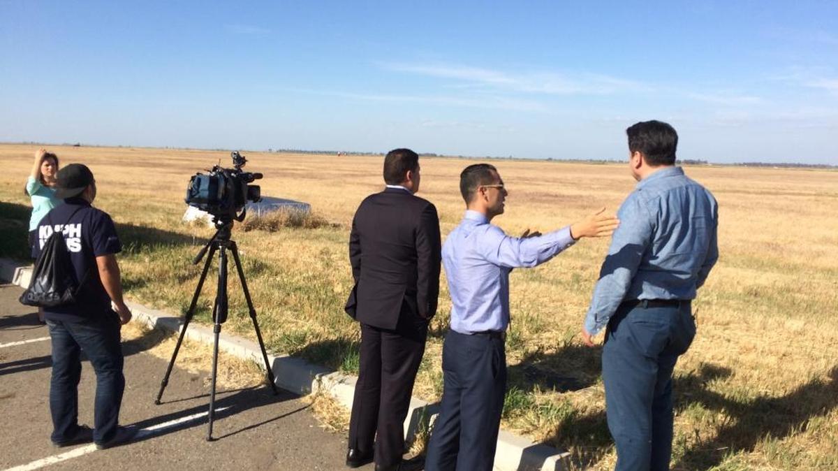 Marcelo Calero, base spokesman, tells reporters that a car drove across this field and hit the jet.