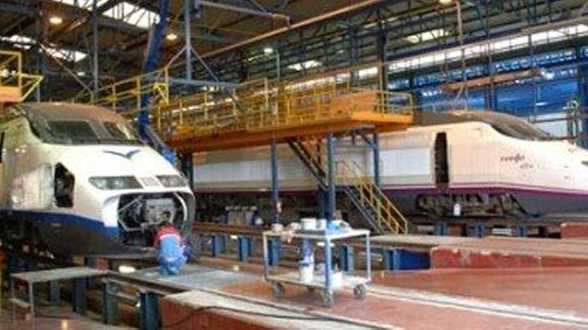 A pair of Spain’s AVE high-speed trains undergo maintenance at a Renfe depot. Renfe is the Spanish government-owned company that operates the nation’s freight and passenger trains.