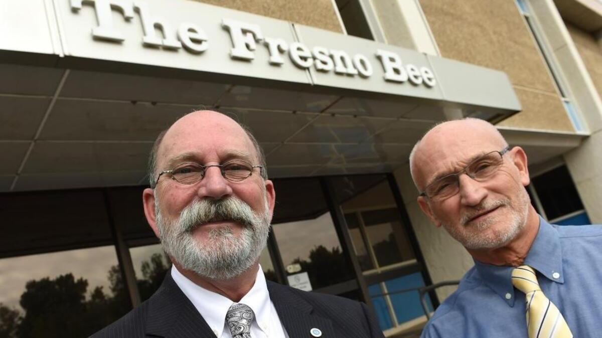 New Fresno Bee publisher Ken Riddick, left, and outgoing publisher Tom Cullinan, right.