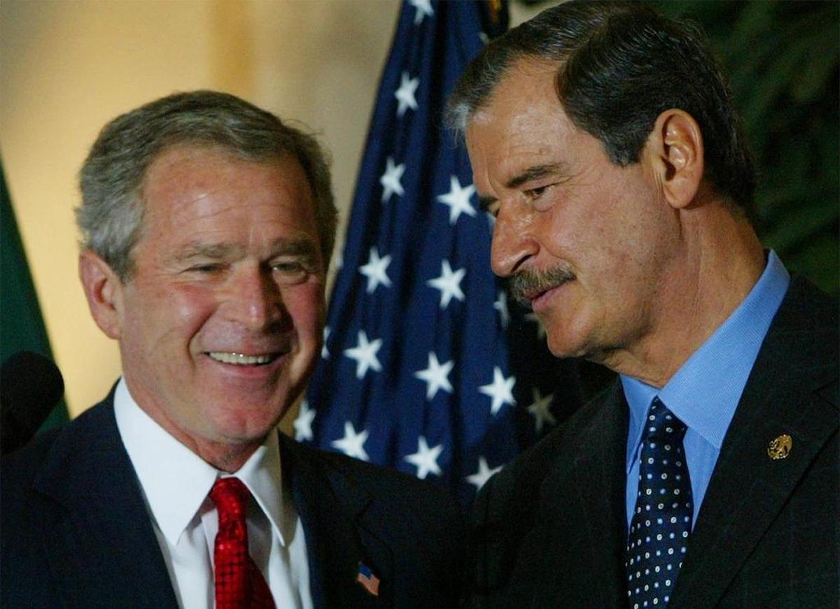 President Bush left, speaks with Mexican President Vicente Fox, right, following a press conference during the Summit of the Americas in Monterrey, Mexico, in 2004.