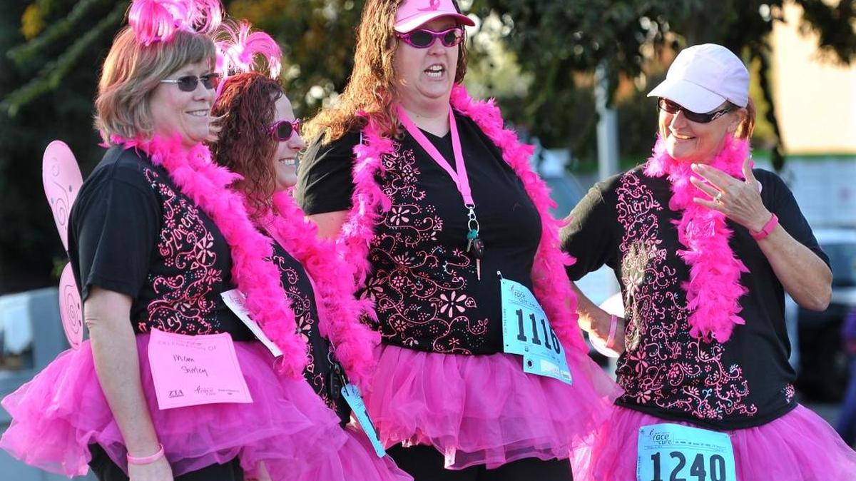 Decked out in pink, Fort Miller Middle School teachers, from left, Kathy Riggs, Amanda Horvath, Katie Navarrette and Sheryl Ballou, wait for their event during the annual Susan G. Komen Central Valley Race for the Cure at Fresno State in 2013. Susan G. Komen Sacramento Valley and Komen Central Valley are merging to serve people in nine new counties, including Madera, Kings, Merced and Tulare.