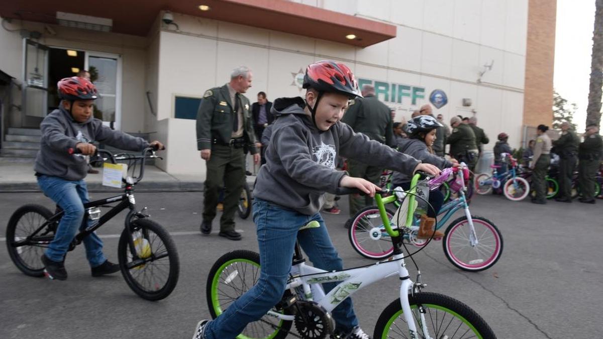 Children in the Sheriff’s Junior Explorer Youth Development Program received new bicycles and helmets Wednesday at the Tulare County Sheriff’s Office as a reward for doing well in school. Twenty bicycles were given away, but throughout the year up to 200 bicycles are given away thanks to donations from businesses and individuals.