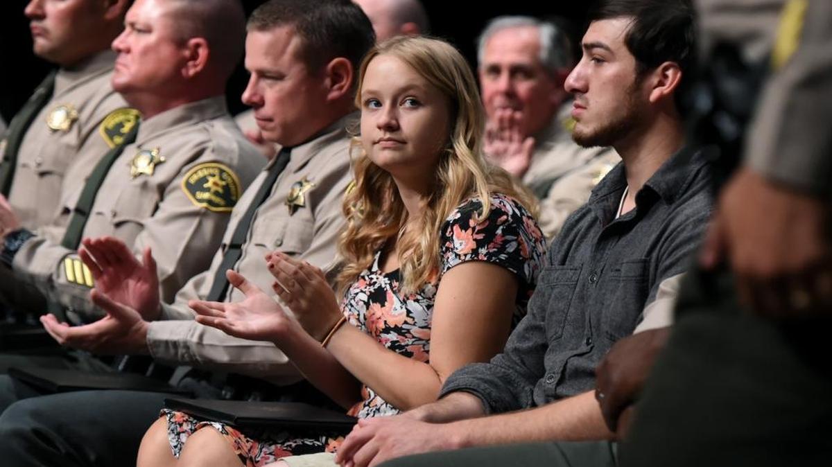 Citizens Brittany Parnell and Charles Vasquez join Fresno County sheriff’s personnel at an awards ceremony Thursday at the Veterans Memorial Auditorium in downtown Fresno. Parnell and Vasquez are credited with helping save a 3-year-old girl who was kidnapped when a thief stole the car she was in, left running at an auto shop parking lot on March 29, 2016.