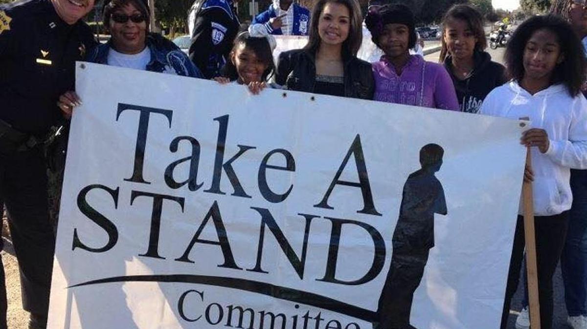 Kayla Foster, far right, was a youth ambassador for the Take a Stand Committee, a non-violence organization in Fresno. Foster was shot to death Monday while in front of a house with friends.